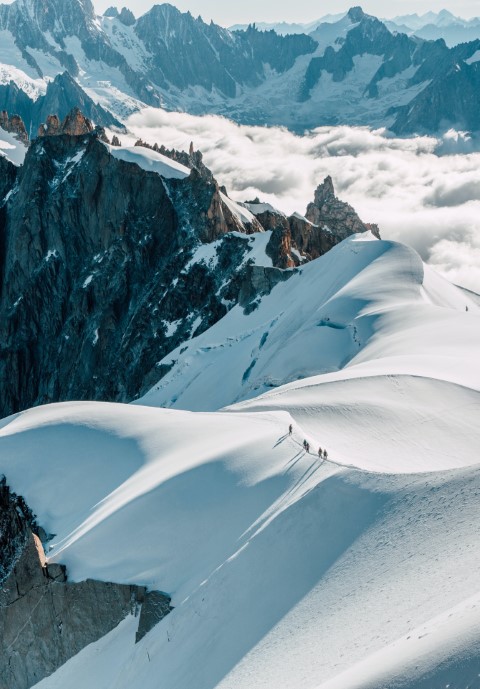 mountaineers on snowy ridge