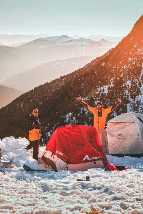 happy campers in snowy mountain